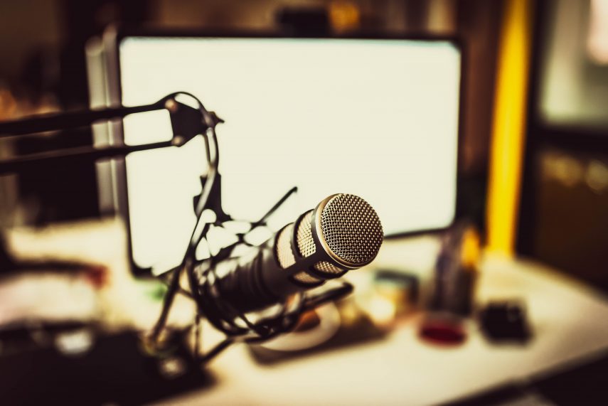 photo of home studio set up with microphone and computer screen